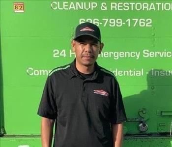 Pablo in front of SERVPRO truck